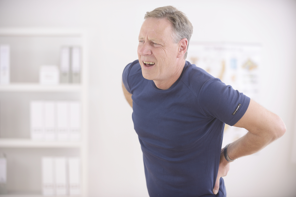 man having lower back sciatic pain
